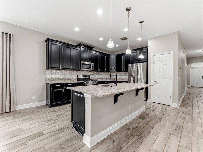 Building Photo - 8947 Garden Party Dr