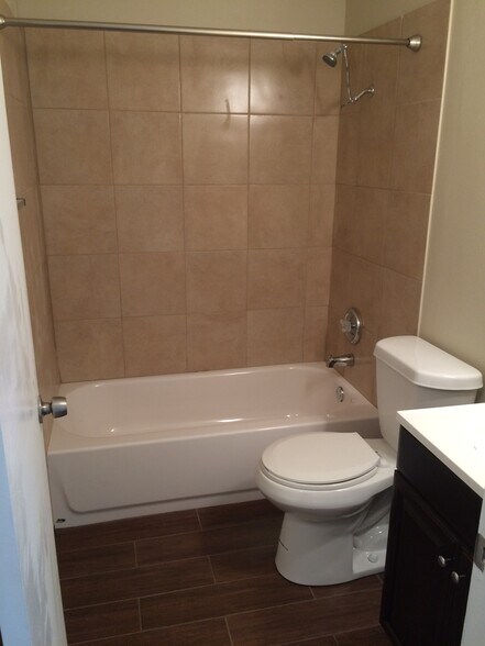 New flooring, tile shower, sink, and toilet. All are new. - 9214 Cliffvale Street
