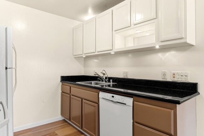 Building Photo - Modern Oakland Living: New Floors, Private Balcony, and Parking