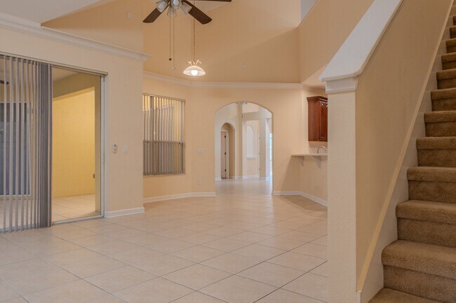 Building Photo - Spacious 5BR Home in Falcon Trace | 3-Car Garage | Screened Patio | Resort-Style Amenities Rent: ...