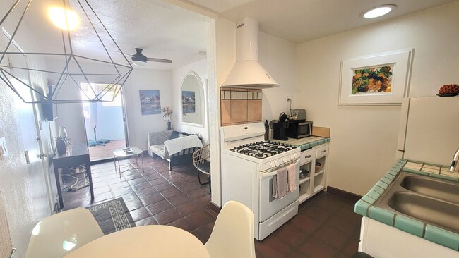 Building Photo - Charming, Fully Furnished Spanish-Style Du...