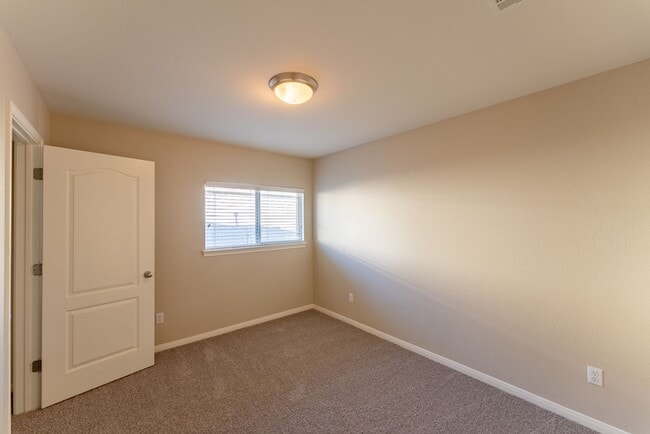 Building Photo - Charming Brick Home with Open Floorplan, Vaulted Ceilings, and Luxurious Amenities—Perfect for An...