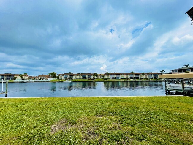 Building Photo - Updated 2-bedroom waterfront duplex with walk-in closets, enclosed Florida room, and canal views ...