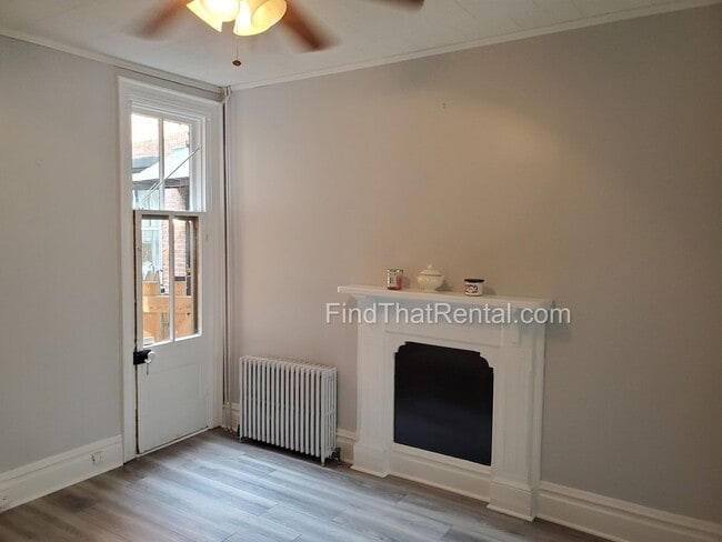 Building Photo - Charming Historic Retreat with Private Fenced Yard & Parking – Prime Downtown Location