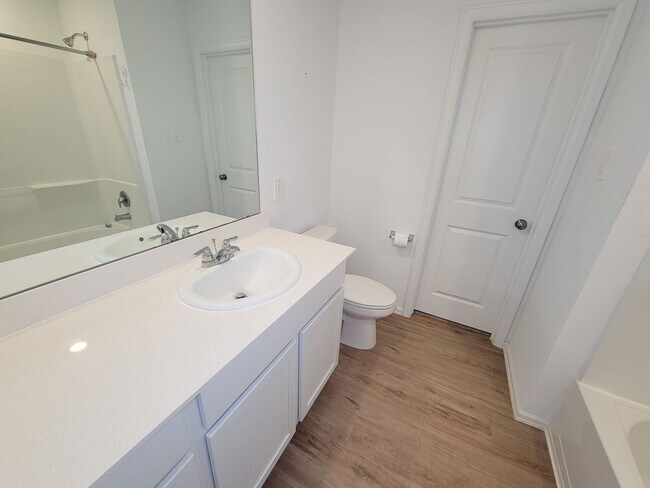 Building Photo - This single-story home has a comfortable layout with three bedrooms and a living area all on one ...