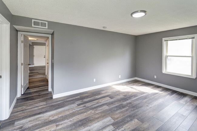 Master bedroom and view down hallway. - 499 Wright St