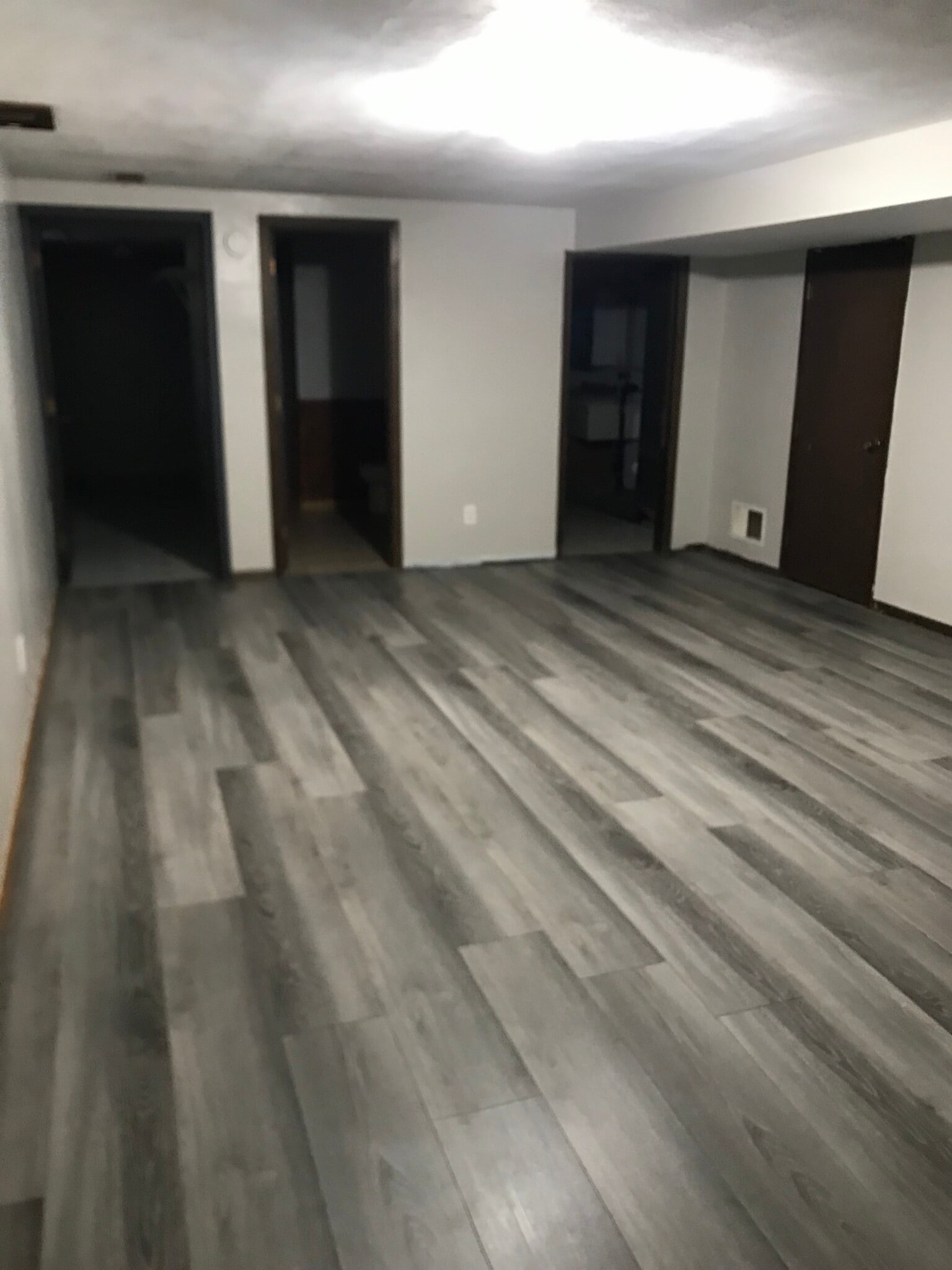 Family room downstairs with access to large walk-in closet, Bathroom, Laundry room, & double garage - 729 3rd St