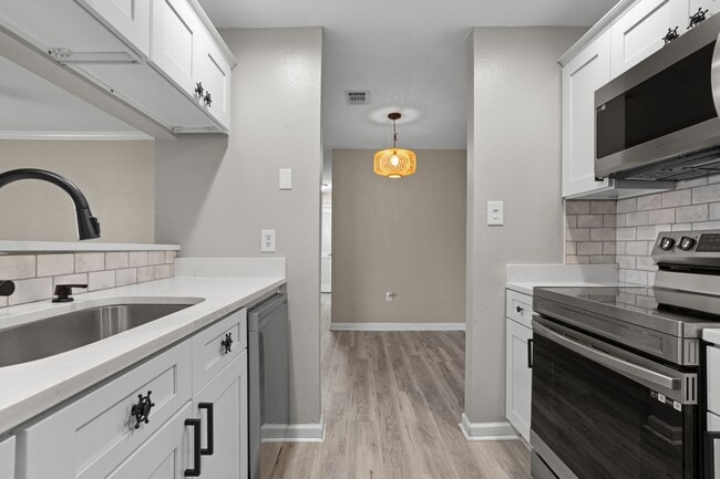 Building Photo - Welcome to Harbor Landing Condominiums — where coastal living meets convenience!