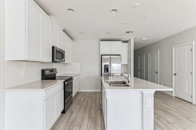 Building Photo - Stunning 3 bedroom, 2.5 bathroom townhome located in a highly desirable gated community