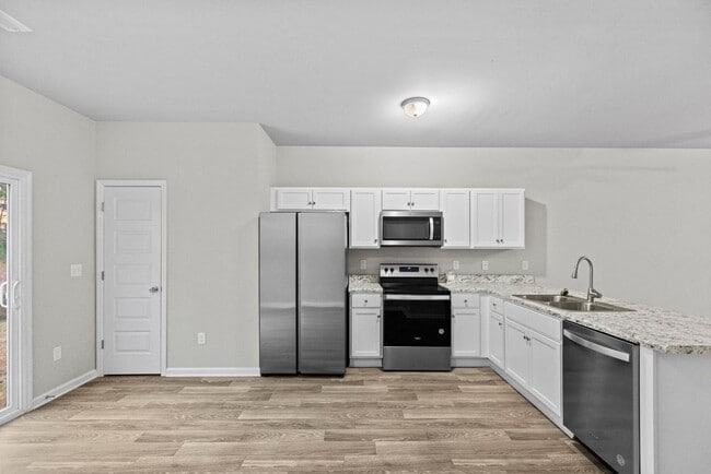 Building Photo - 50% off the first months rent if a lease is signed by 1/15