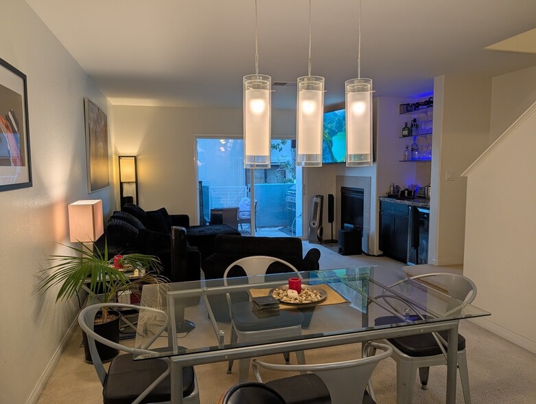 View of dining area facing living room and balcony - 3542 Shoreline Bluff Lane