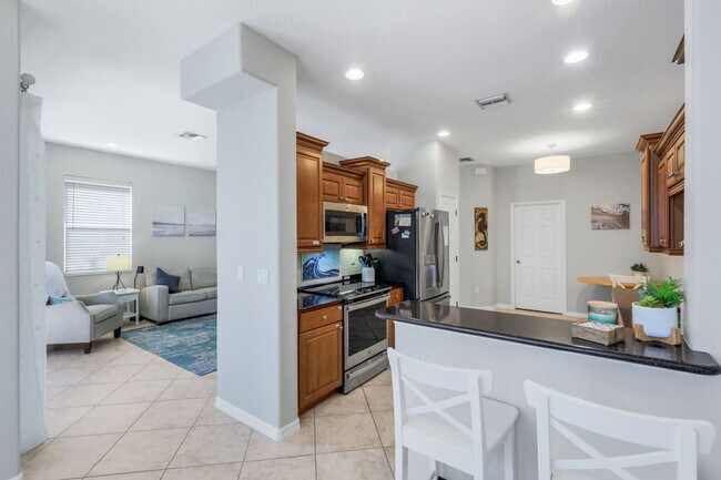 Building Photo - "Spacious 3-Bedroom Condo Retreat in Ester...