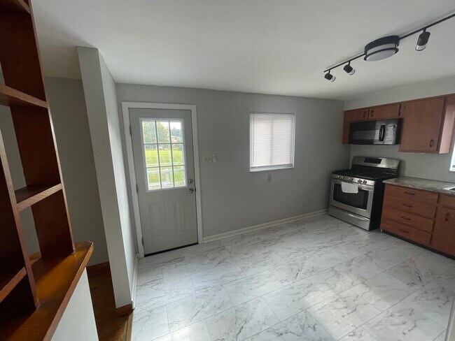 Kitchen w/new lighting. - 1630 Fiat St