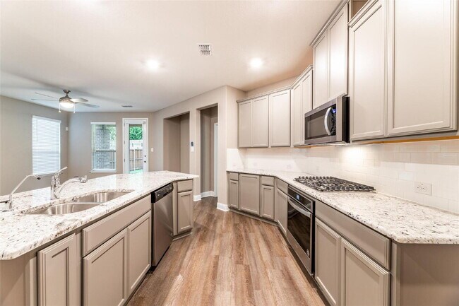 Building Photo - Spacious Allen Home with Modern Kitchen, Fenced Backyard & 2-Car Garage