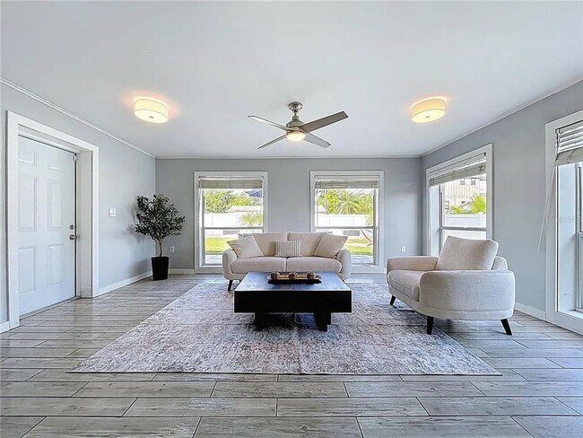 Building Photo - Modern luxury meets Florida charm in this ...
