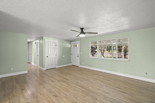 Building Photo - Charming 3-Bedroom Bend Home on 1/2 Acre with Expansive Yard, Mature Trees & Covered RV/Boat Storage