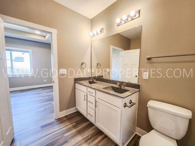 Building Photo - Spacious Waukee Ranch | 4 Bedrooms | 3-Car Garage | Finished Basement