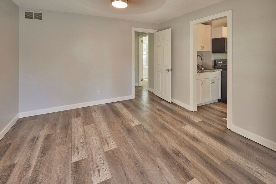 Living Room leads to kitchen and bedroom - 2439 8th Ave N