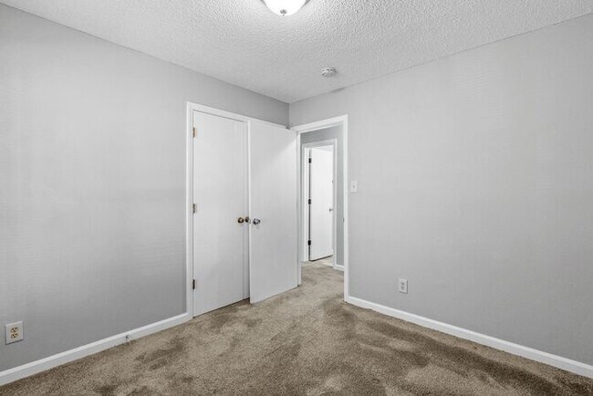 Building Photo - NE Home - Updated Kitchen and Bathrooms! SS Appliances, Fire Place, Front Porch & Deck, Fenced Yard!