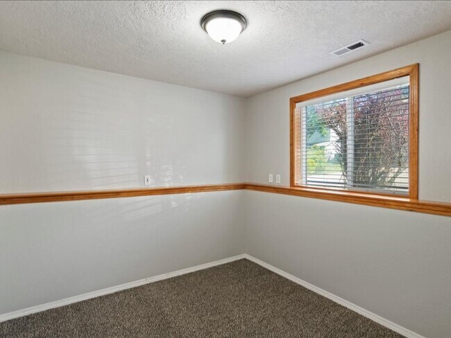 Building Photo - June Rent Free!!  Move Today!  Four Bedroom, Three Bath Home with Beautiful Backyard, Two Car Gar...