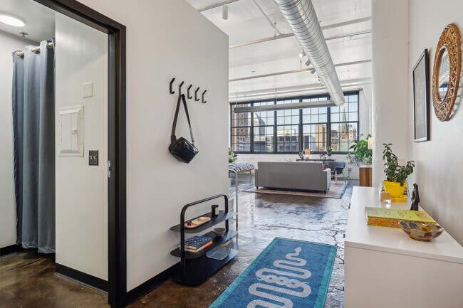 Dramatic high ceilings, huge windows, and exposed brick. - 500 Robert St N