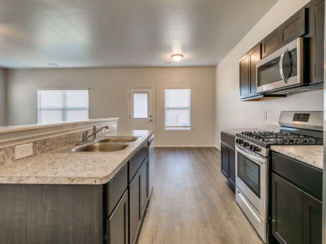 Building Photo - *Pre-leasing* Four Bedroom | Two and a Half Bath Duplex in Redstone Ranch with Full Service Lawncare