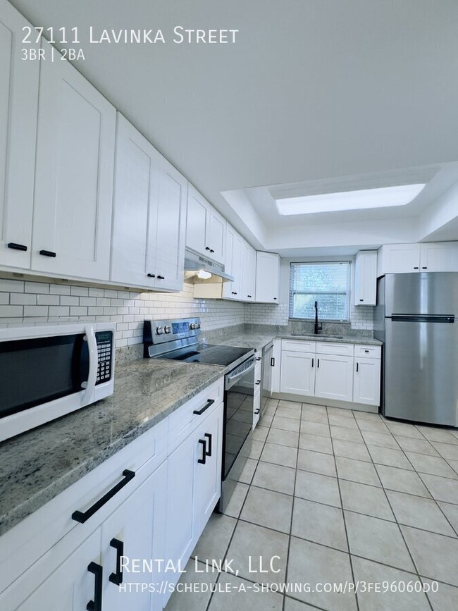 Building Photo - Newly updated home with a modern kitchen, ...