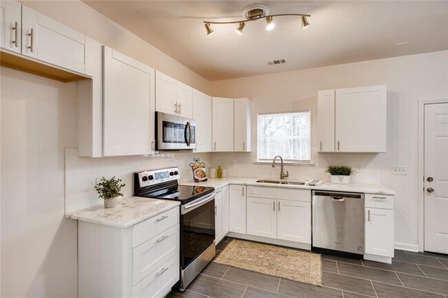 Kitchen, refrigerator is included. - 1999 Meador Ave SE