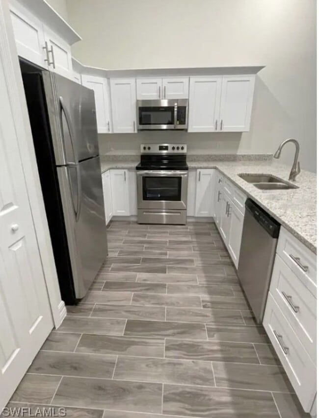 Building Photo - 2/2/1+DEN - GREAT LOCATION IN LEHIGH ACRES- BELL BLVD