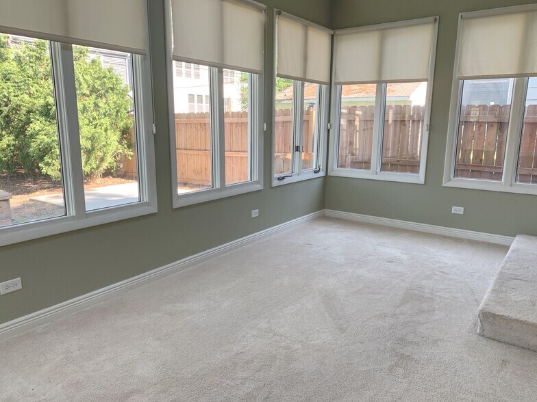 Bonus sunroom lined with windows giving tons of natural light. - 1336 N Eagle St
