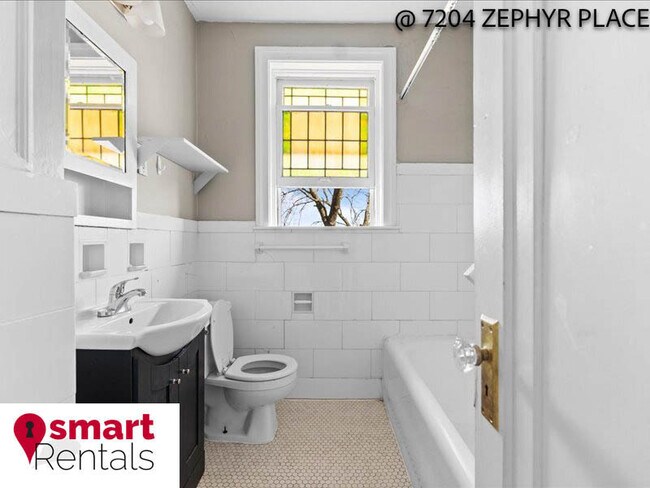 Building Photo - 7204 Zephyr Place - 2E