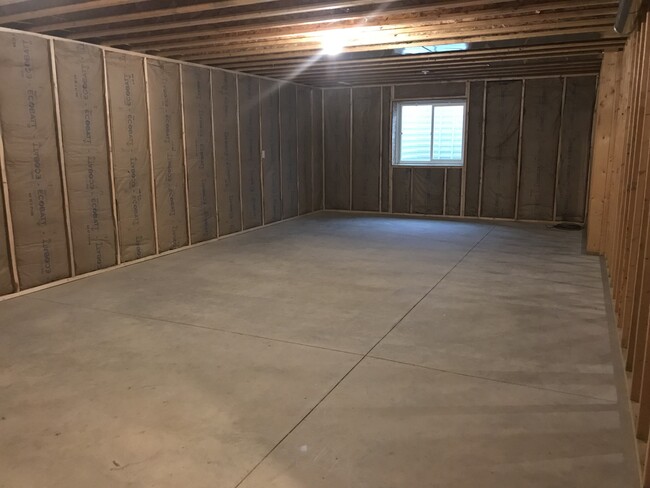 Unfinished basement w/ egress window - 100 Scenic Drive