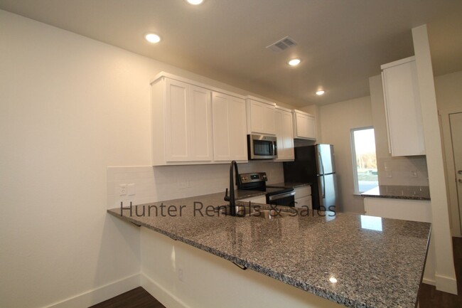 Building Photo - Upscale Four-Bedroom Townhome!