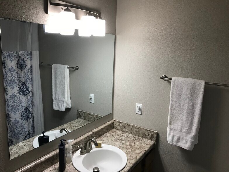 Upstairs hall bathroom. New lighting, faucet, countertop and more! - 1382 N Dawn Dr
