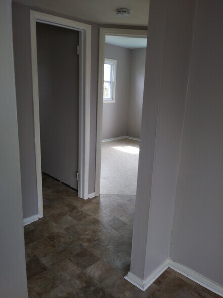 Hall to bedrooms and full bath - 7005 John Adams Way