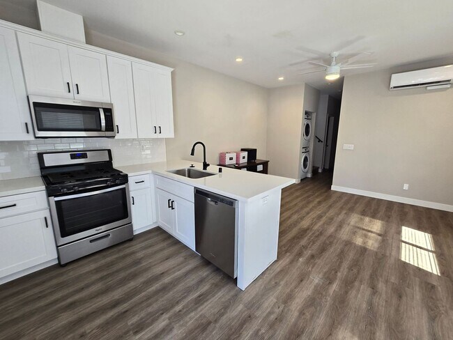 Building Photo - NEW 4BD/2BA, Large Balcony!!