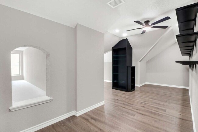 Building Photo - "Spacious 4-Bedroom Sanctuary with Cozy Fireplace in San Antonio's Prime Location!"