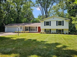 Building Photo - Private 4 Bedroom Home on 0.75 Acres with Great Room Fireplace, Wet Bar & 3-Season Room, 2 Car At...