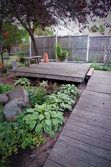 Spring, summer and fall - this deck and garden area are ready for you to be outdoors enjoying life and entertaining friends! - 3517 E 32nd Ave