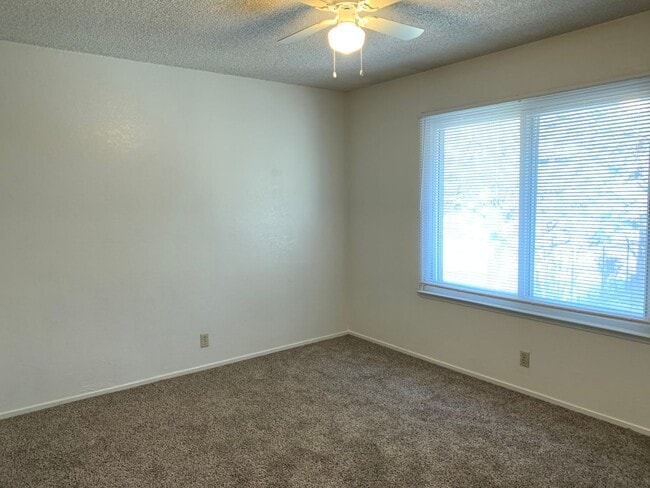 Building Photo - ENJOY THE POOL THIS SUMMER IN THIS GATED C...