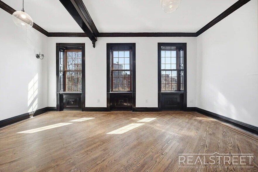 Building Photo - Timelessly Renovated Historic Triplex with...
