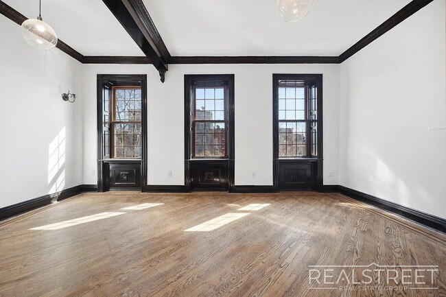 Building Photo - Timelessly Renovated Historic Triplex with...