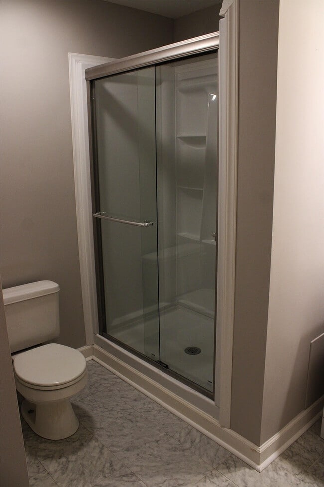 There is a new sliding glass shower. - 7837 Heaton Way
