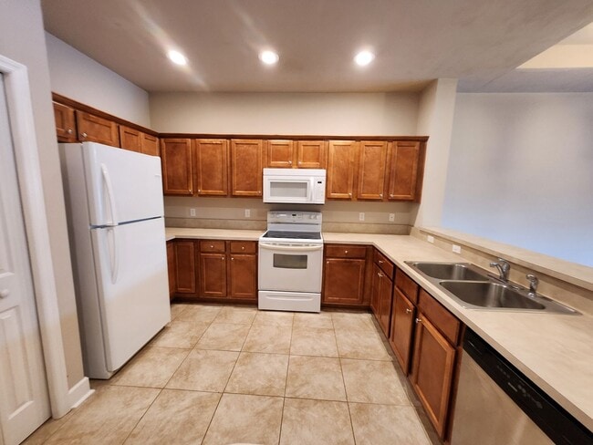 Building Photo - 3/2 townhome available for rent August 6, 2026, renting for $1795 per month, privacy fenced back ...