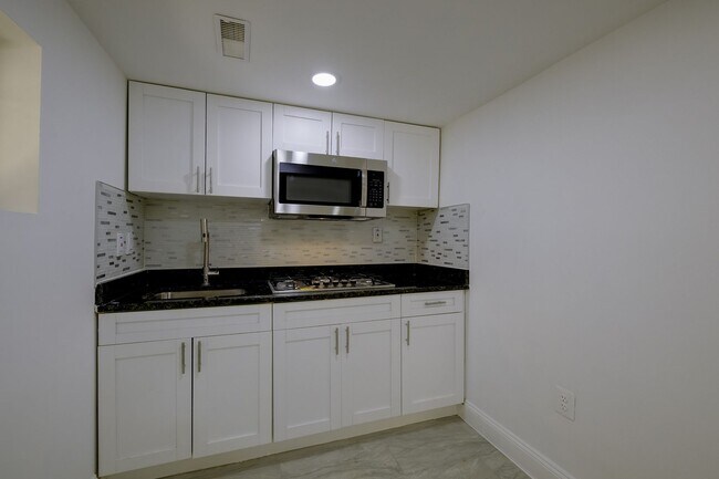 Building Photo - Charming & Renovated Petworth Rowhouse with Parking -  Available Now!