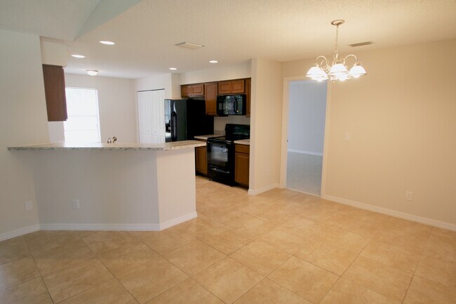 Building Photo - Spacious 3BR/2BA Home | Large Yard | Lawn Care Included | Prime Port St. Lucie Location