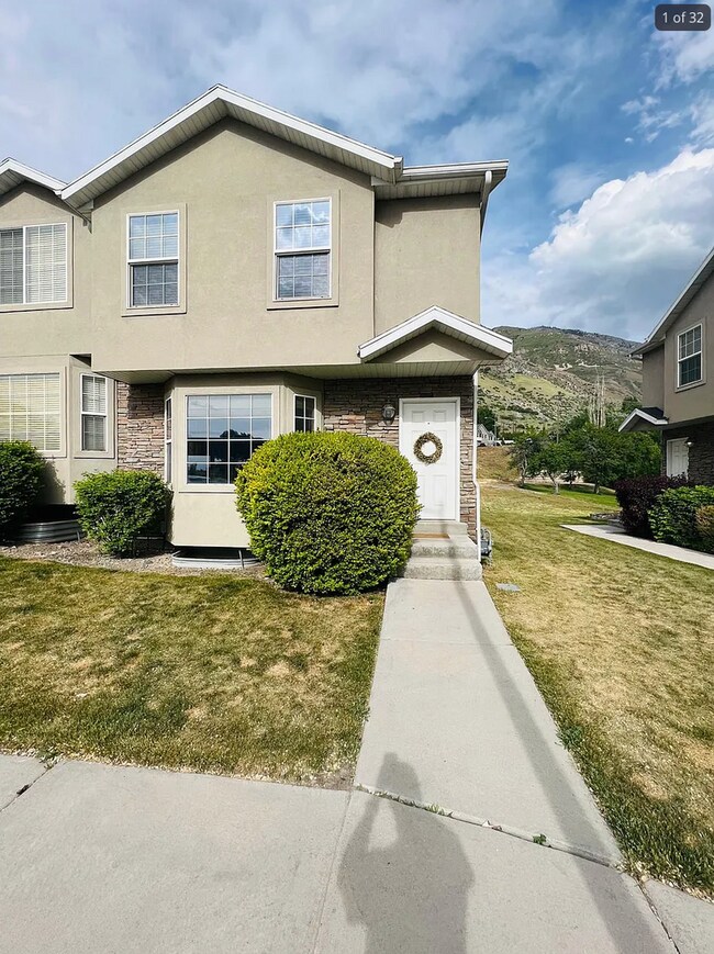 Building Photo - Spacious End-Row Townhome