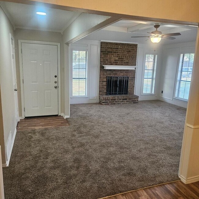 Building Photo - Three bedroom and two bathroom nicely remodeled with new flooring. Large wood fenced backyard