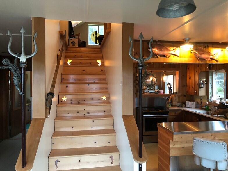 Stairs leading up to bedroom and tv room - 3720 NW Keel Ave