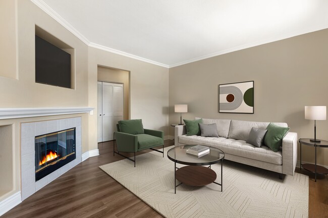 Renovated Package I living room with fireplace and updated hard surface flooring - Avalon Mission Oaks